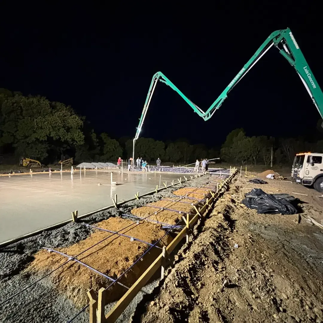 machines pouring concrete in the early morning